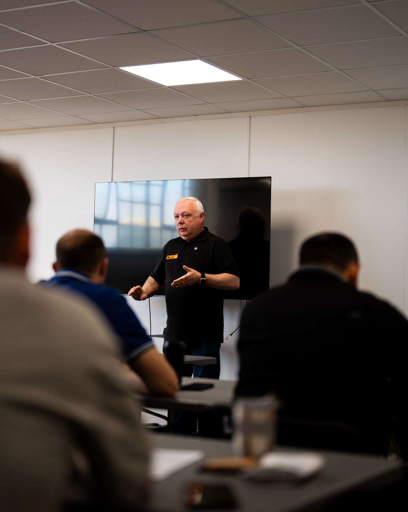 An Alpha Taxis manager leading a driver session
